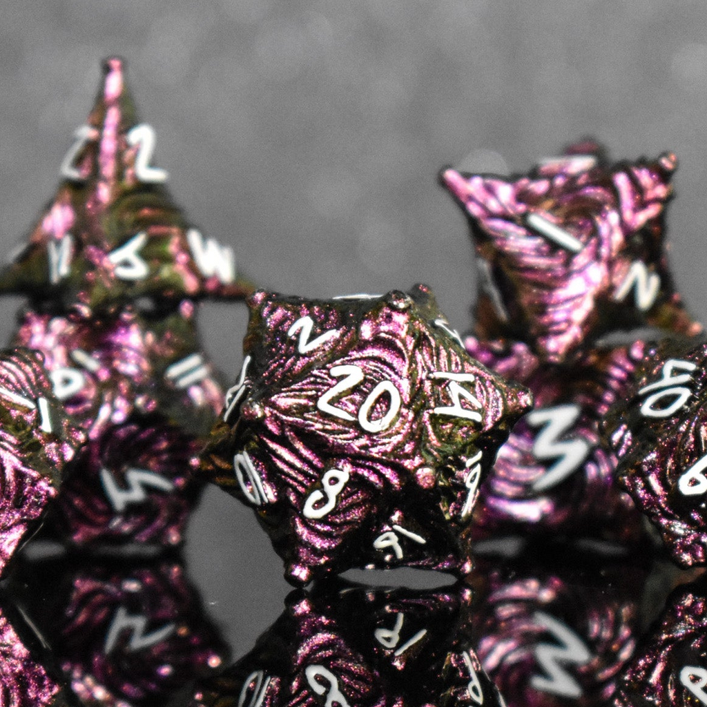 Pearlescent magenta metal vortex dice with white font numbers