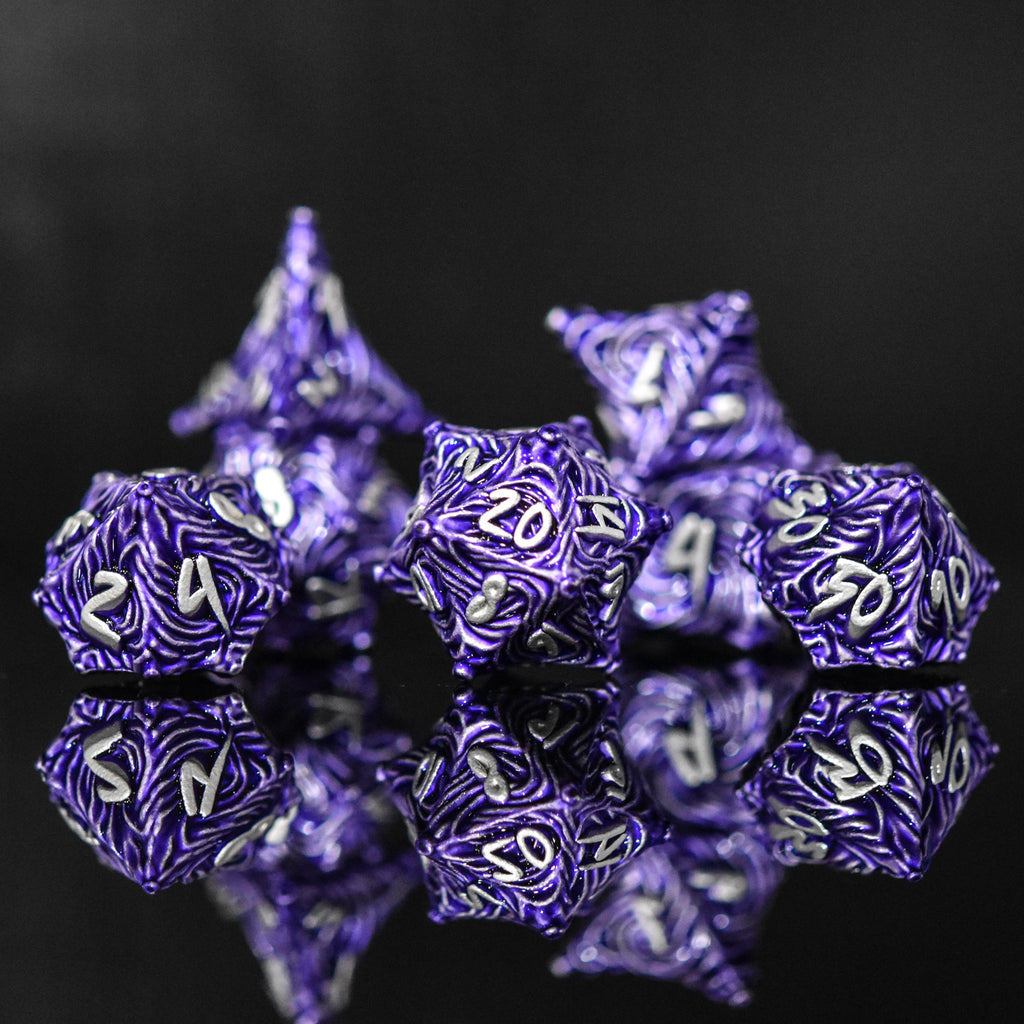 Purple metal vortex dice featuring silver font numbers