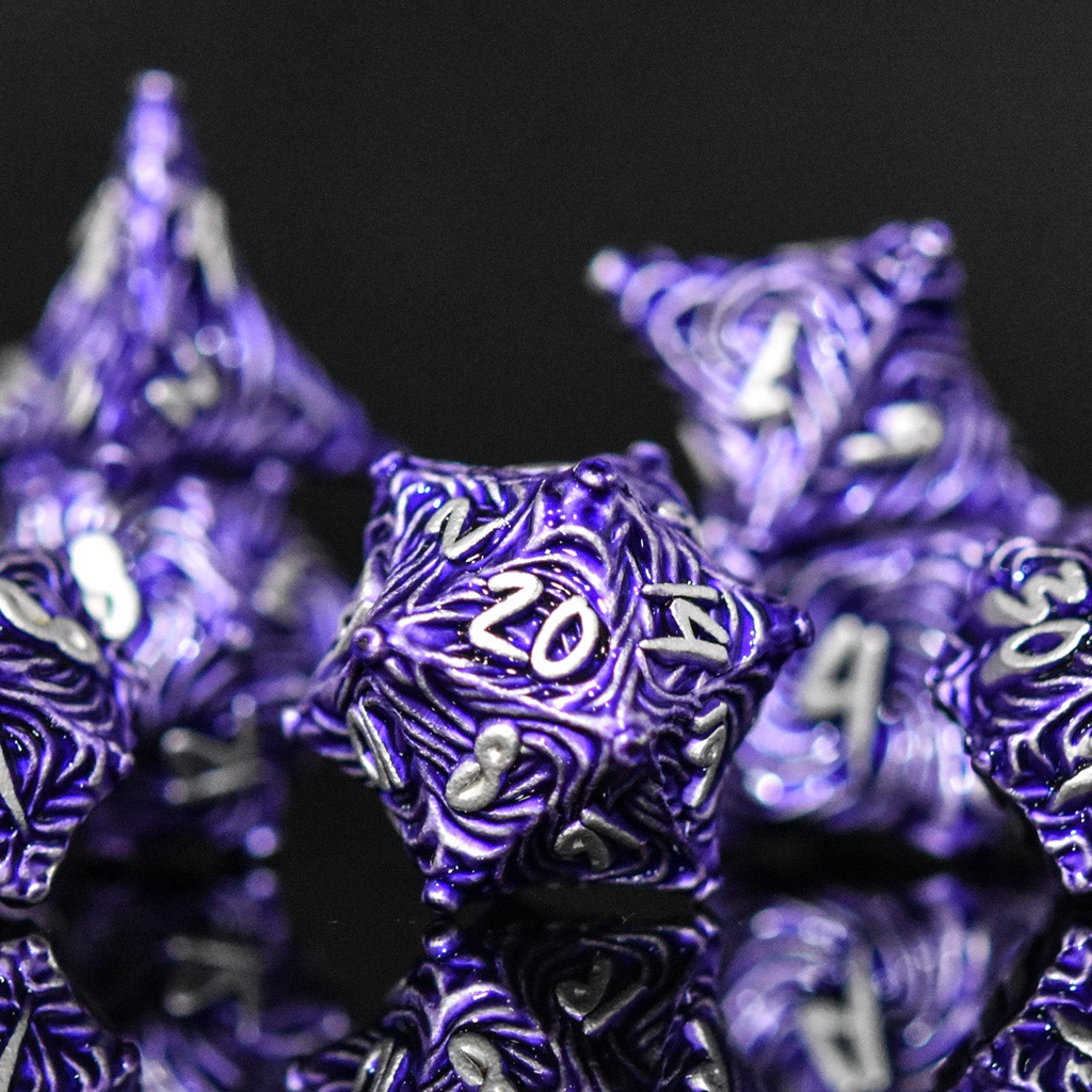 Purple metal vortex dice featuring silver font numbers