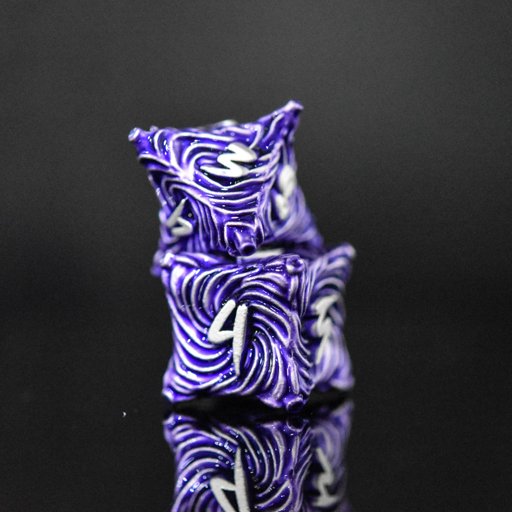 Purple metal vortex dice featuring silver font numbers