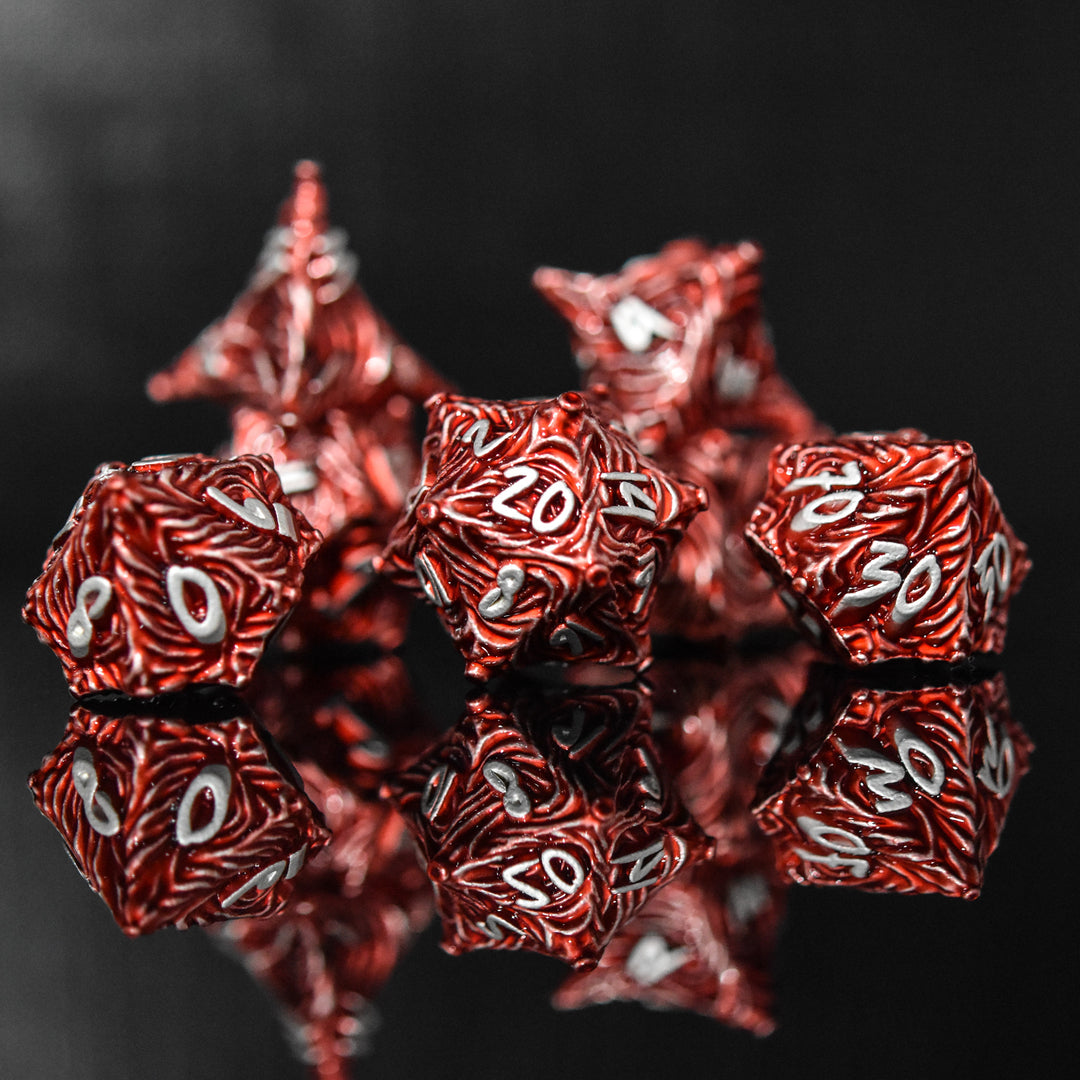 Red metal vortex dice featuring silver font numbers