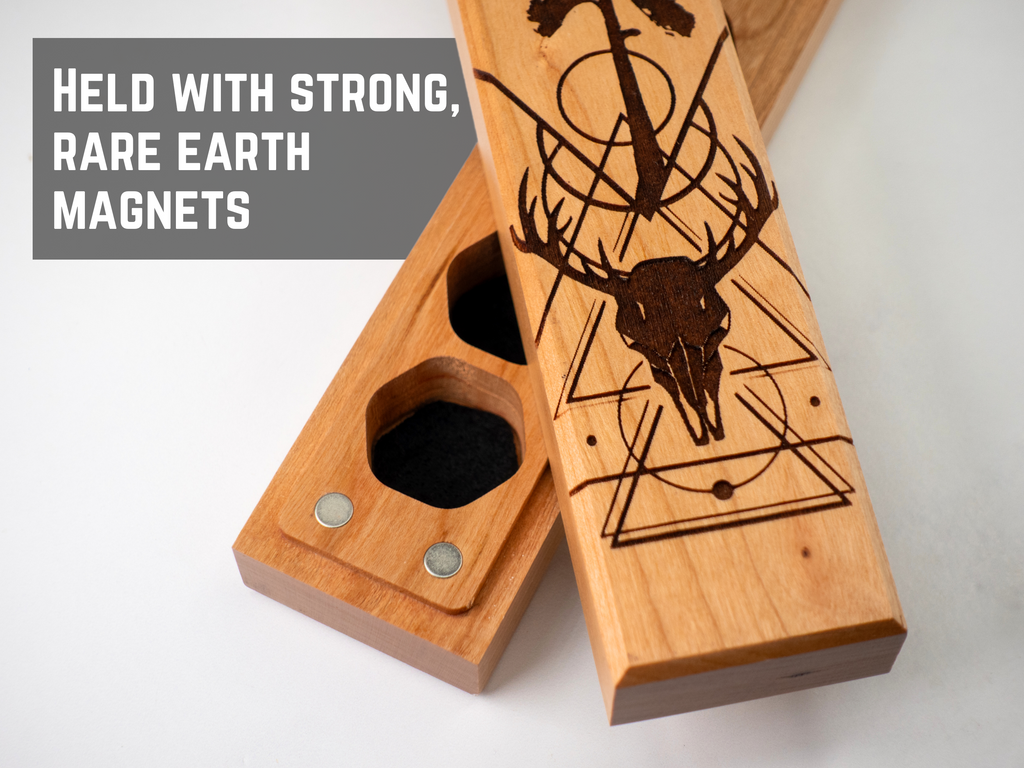Wooden magnetic dice storage boxr with deer skull design on a white background