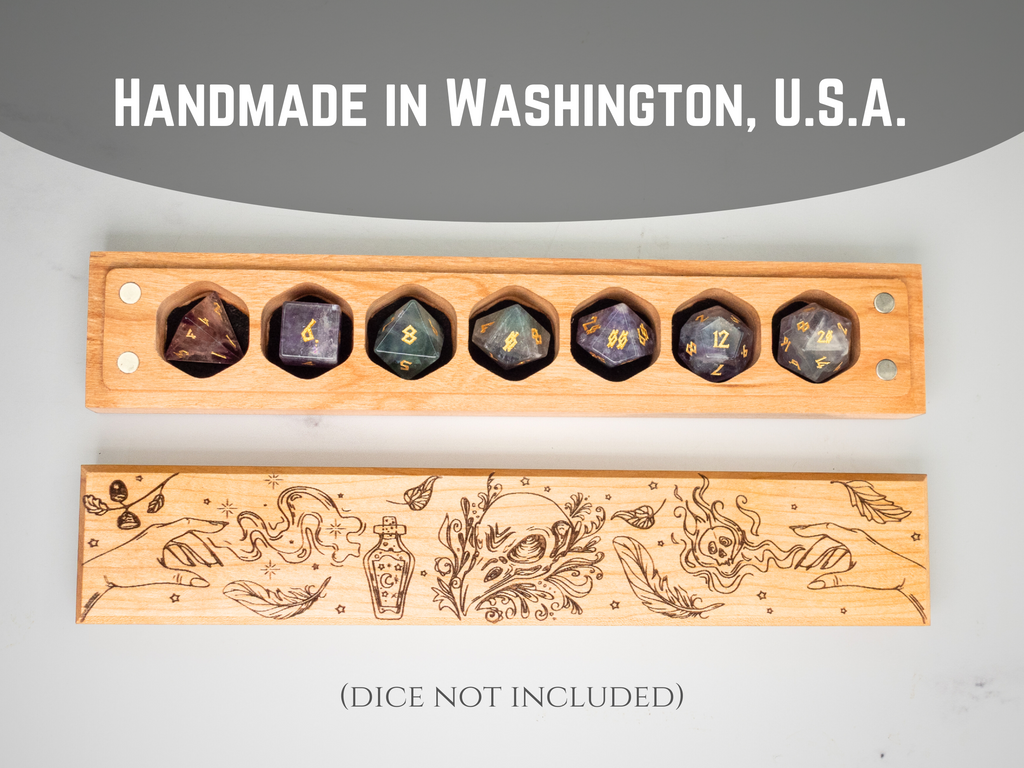 Wooden dice holder with engraved designs on a gray background, featuring text 'Handmade in Washington, U.S.A.'