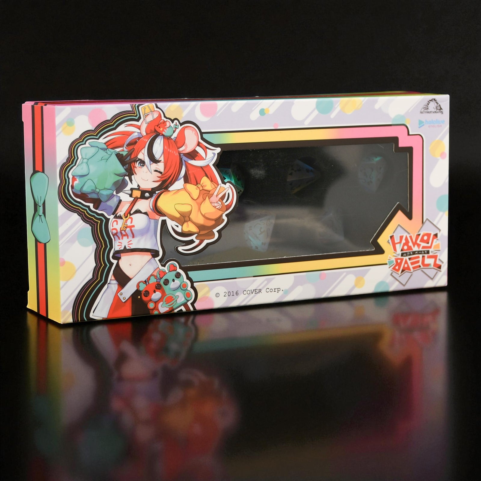 Colorful packaging box with an anime-style character design on a black background