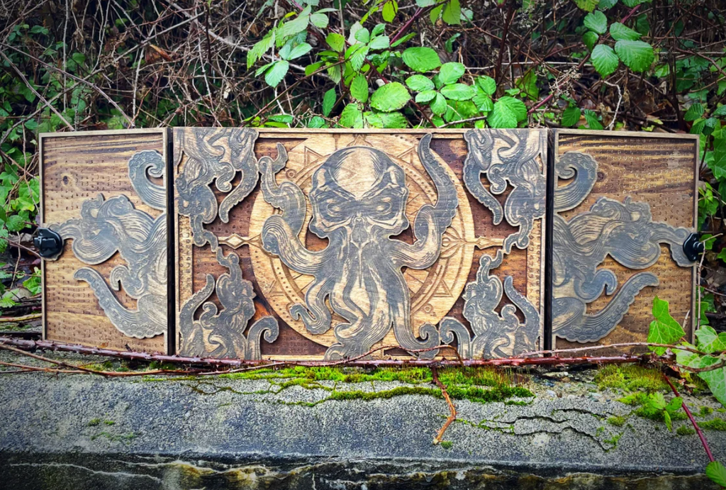 A wooden dungeon master screen featuring Cthulu on the front