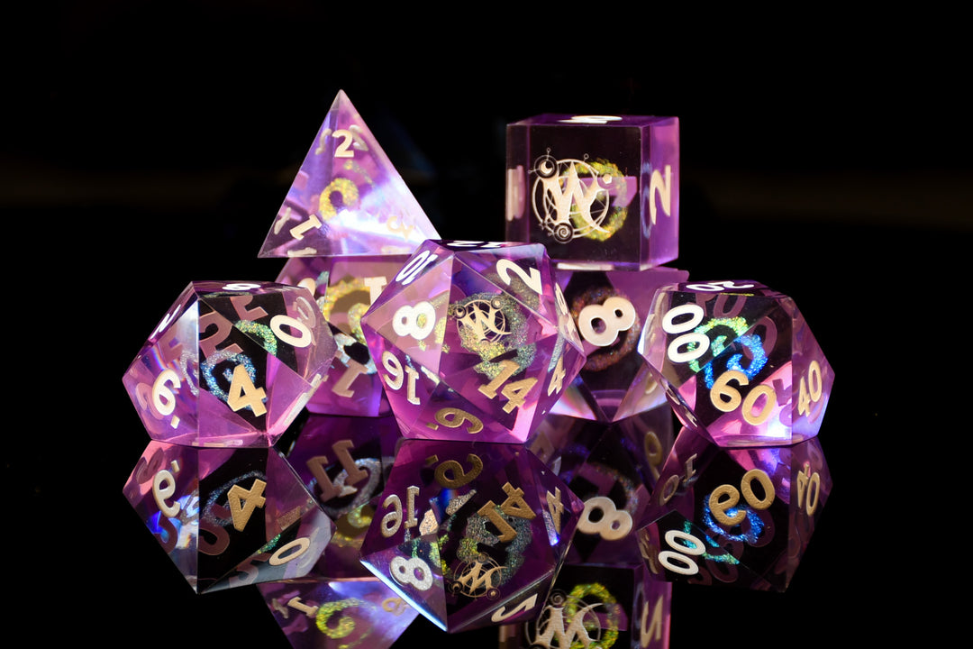 Set of purple polyhedral dice with gold numbers on a black background
