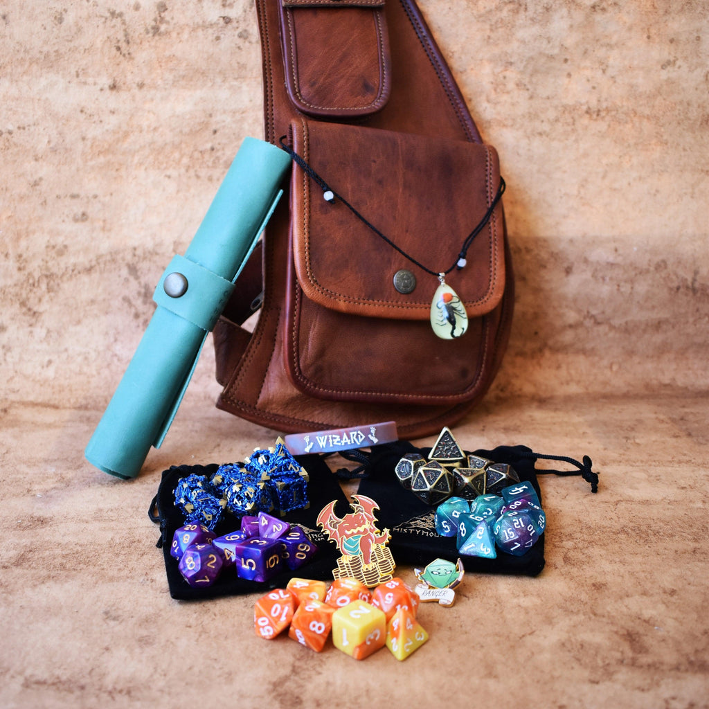 A brown leather sling mystery dice bag with examples of the items within