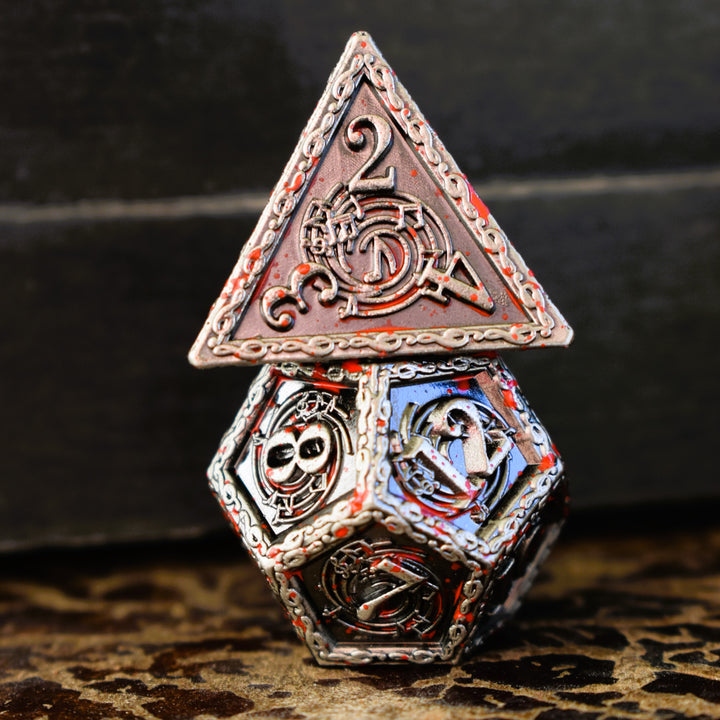 A set of silver metal dice with musical note details around the silver numbers splattered in red blood on a wooden surface, including various shapes such as a d4, d6, d8, d10, d12, and d20.