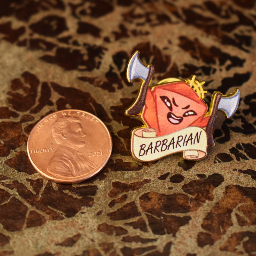 An enamel pin with an illustration of a barbarian character from the game Dungeons and Dragons, featuring a cartoon-style human with wild hair and a banner with the word 'BARBARIAN'.