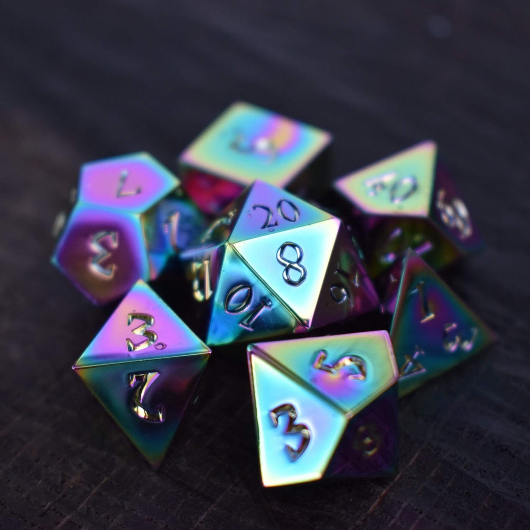 A set of iridescent metal dnd dice with engraved numbers, displaying a metallic sheen with rainbow-like reflections.