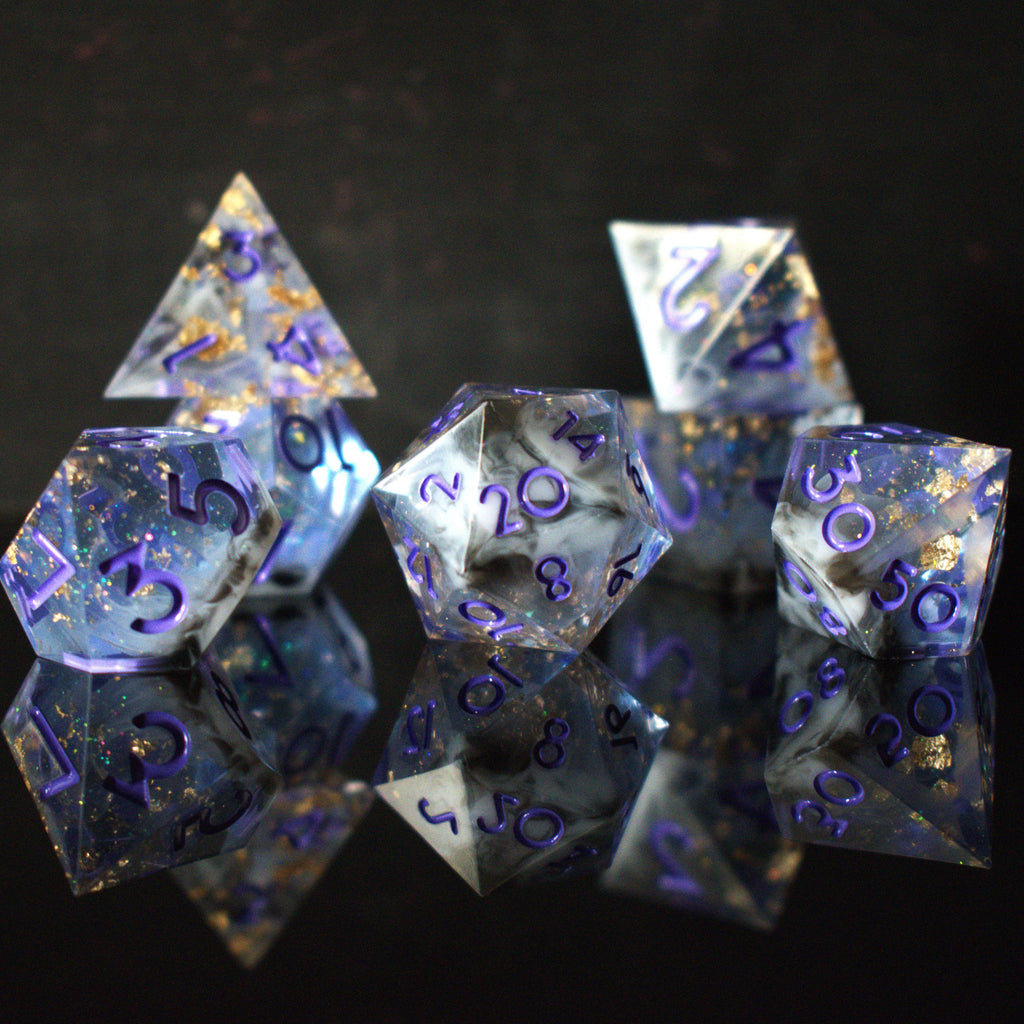 A clear, glittery sharp edge resin dnd dice set with cloudy white and black running through them and purple numbering for tabletop gaming
