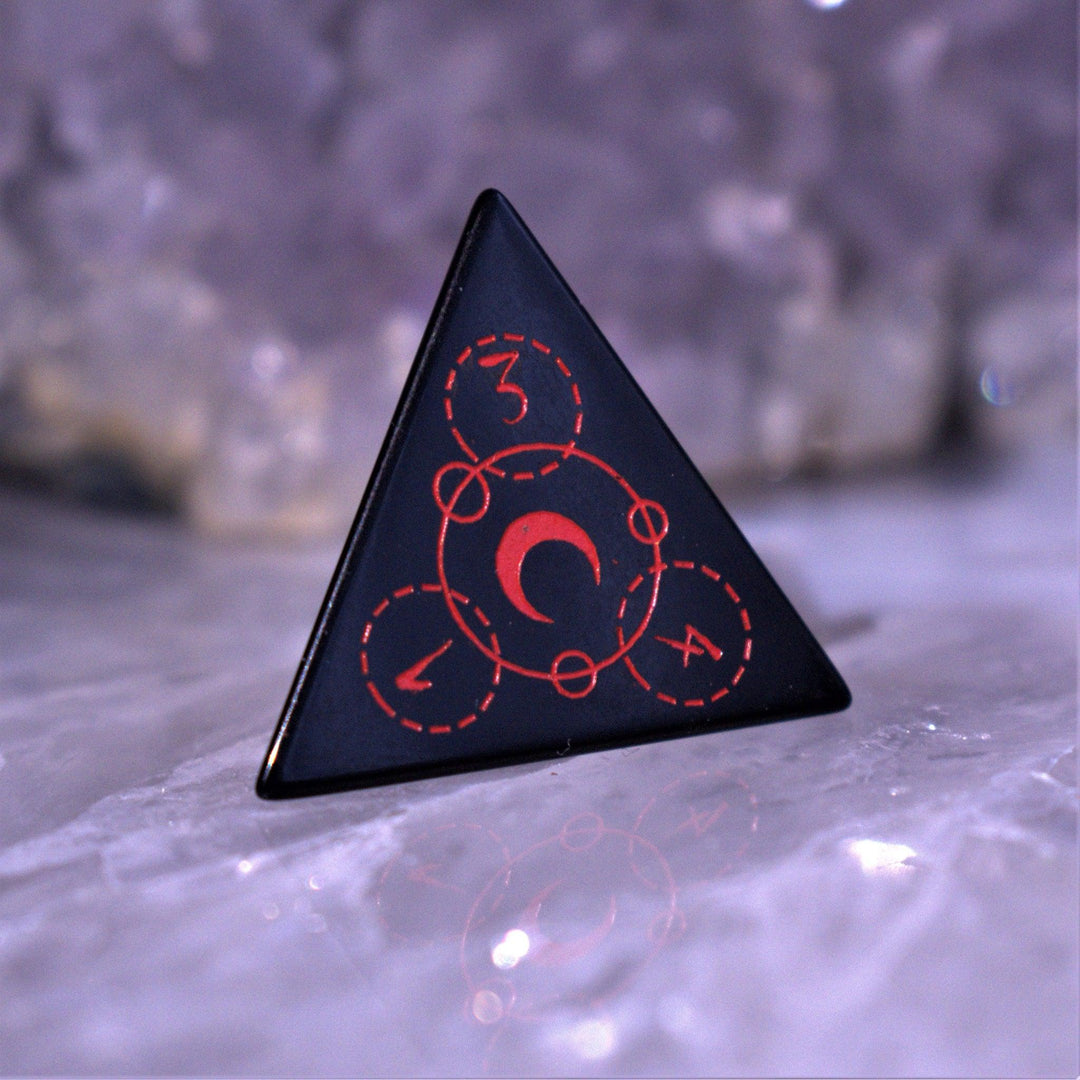 A set of Spellcaster Obsidian Stone polyhedral Dice with red engraved numbers and symbols