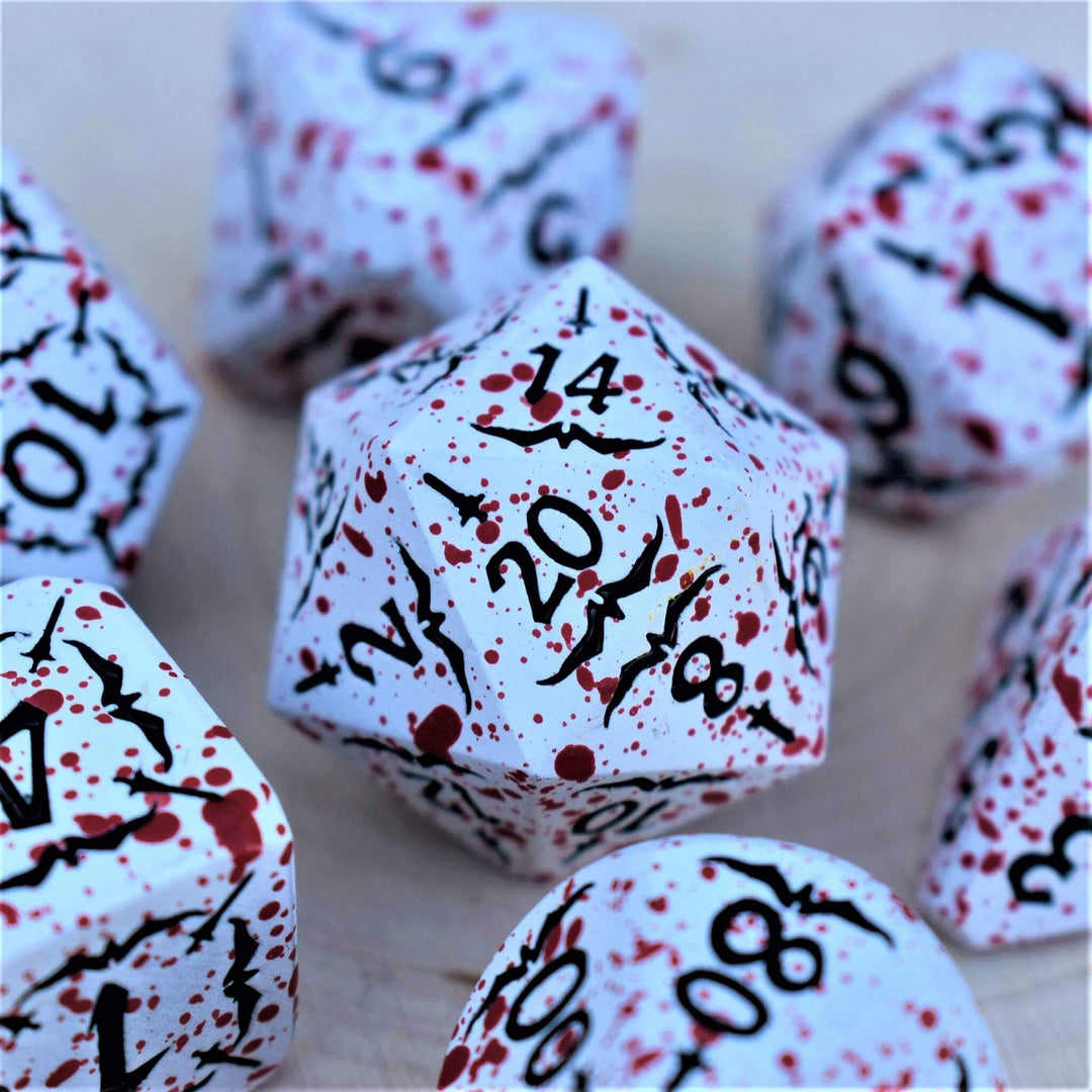 white metal d20 die with blood splatter and black numbering and sword details for tabletop gaming and board games