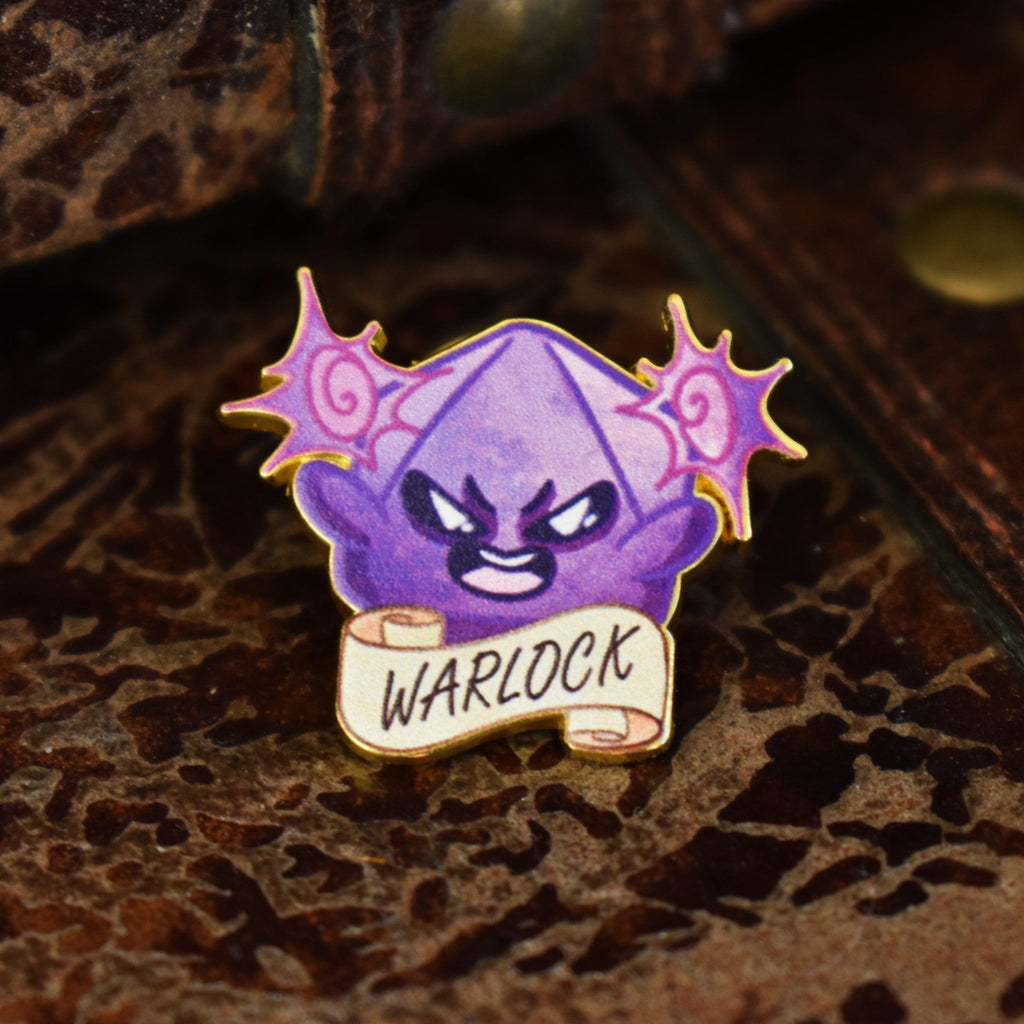 A colorful enamel pin depicting a warlock character from D&D, with a purple theme and the word 'WARLOCK' displayed on a banner.