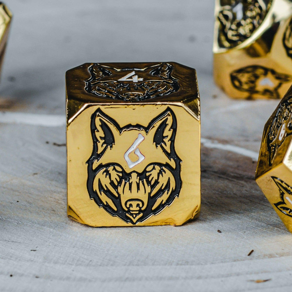 gold metal d6 die with black wolf head design and the number six in white