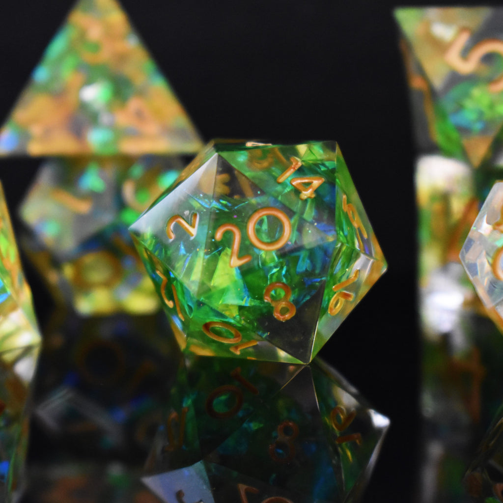 A D20 with bright green inside of clear sharp resin with gold numbers