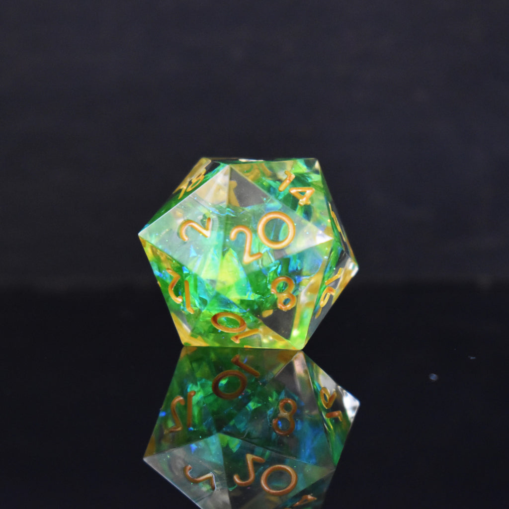 A D20 with bright green inside of clear sharp resin with gold numbers