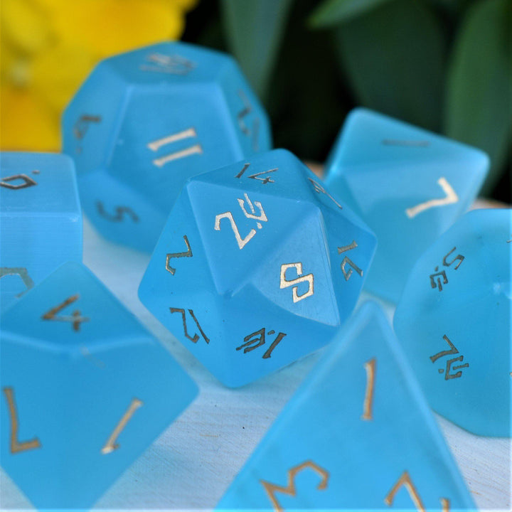 Blue cats eye dice set with gold numbers in a Nordic font