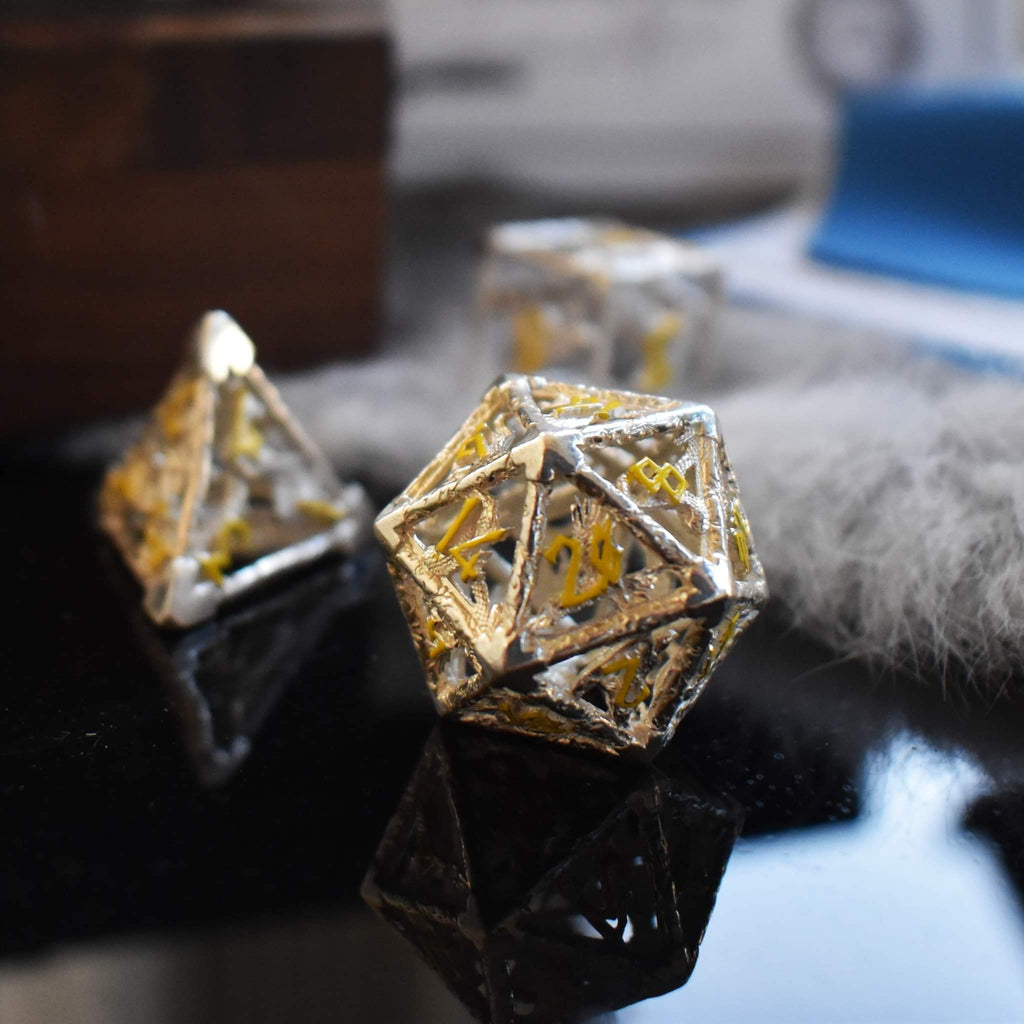 Hollow sterling silver dice featuring yellow numbers in a Nordic font