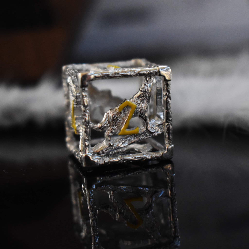 Hollow sterling silver D6 featuring yellow numbers in a Nordic font